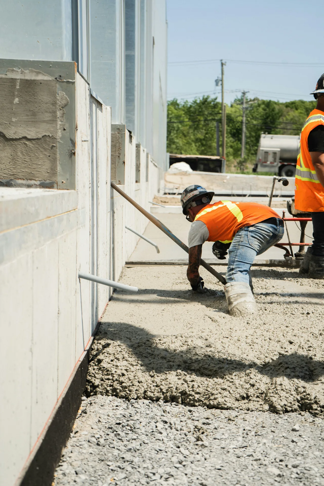 commercial concrete sidewalk along a Boston property edge