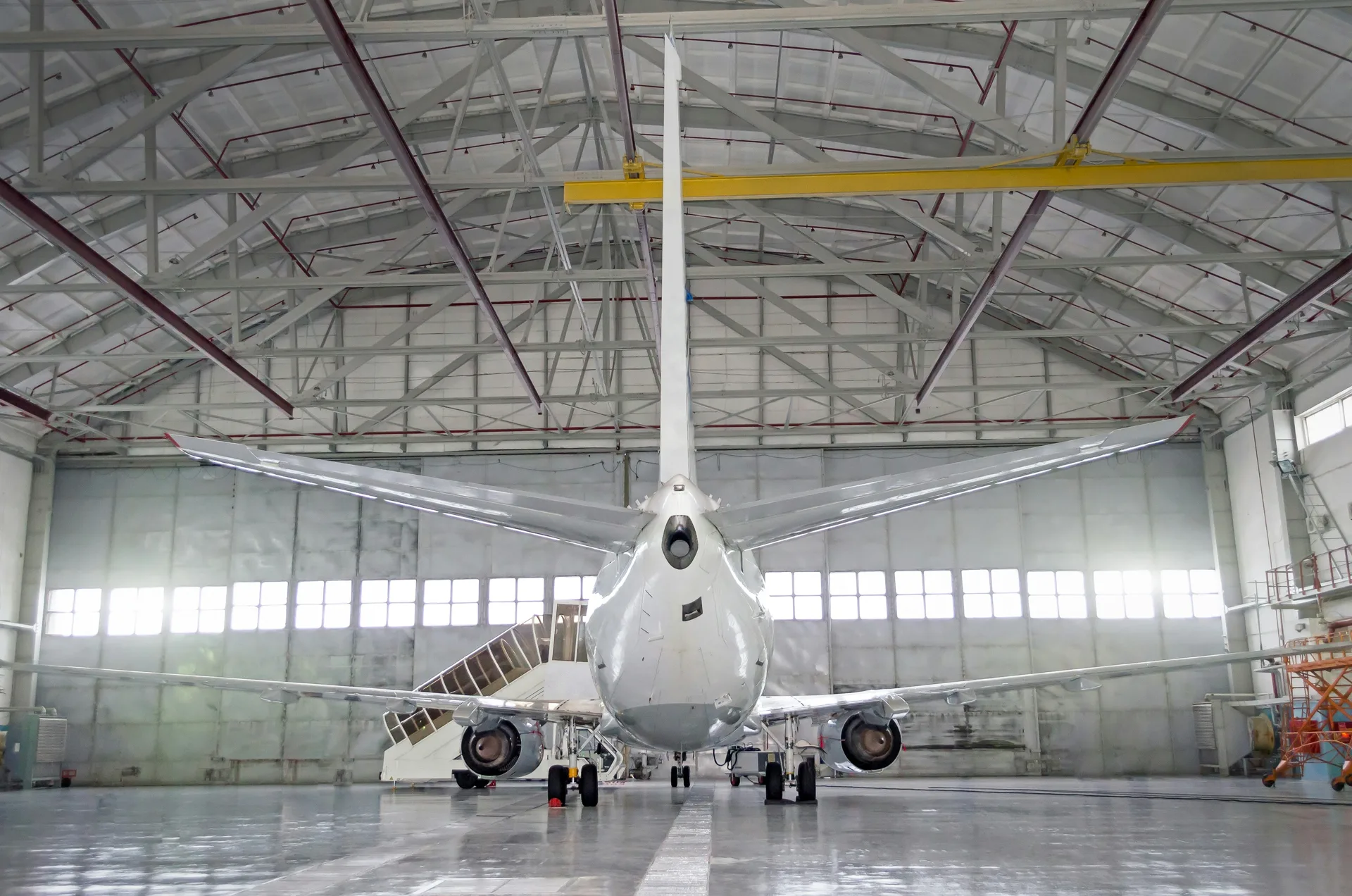 commercial jet on a finished concrete hangar floor in Boston
