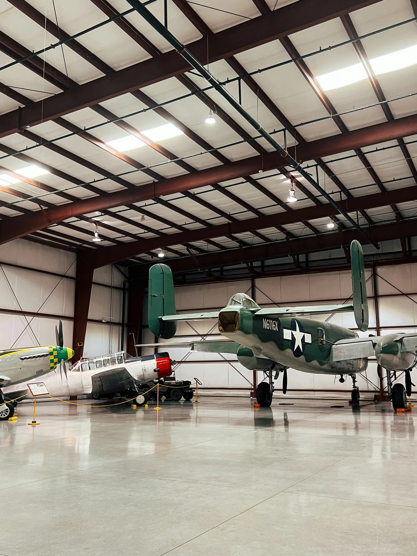 high-gloss concrete hangar floor with a vintage aircraft in Boston