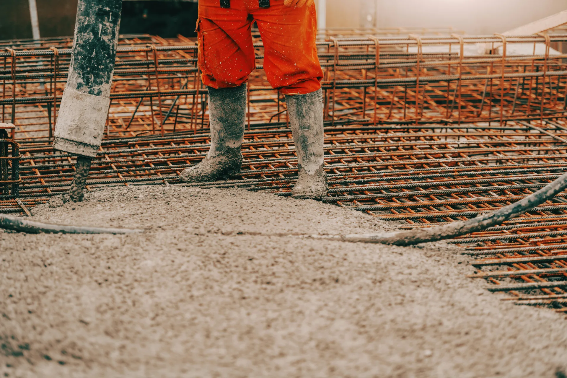 concrete pump operator placing concrete with a coiled hose in Boston