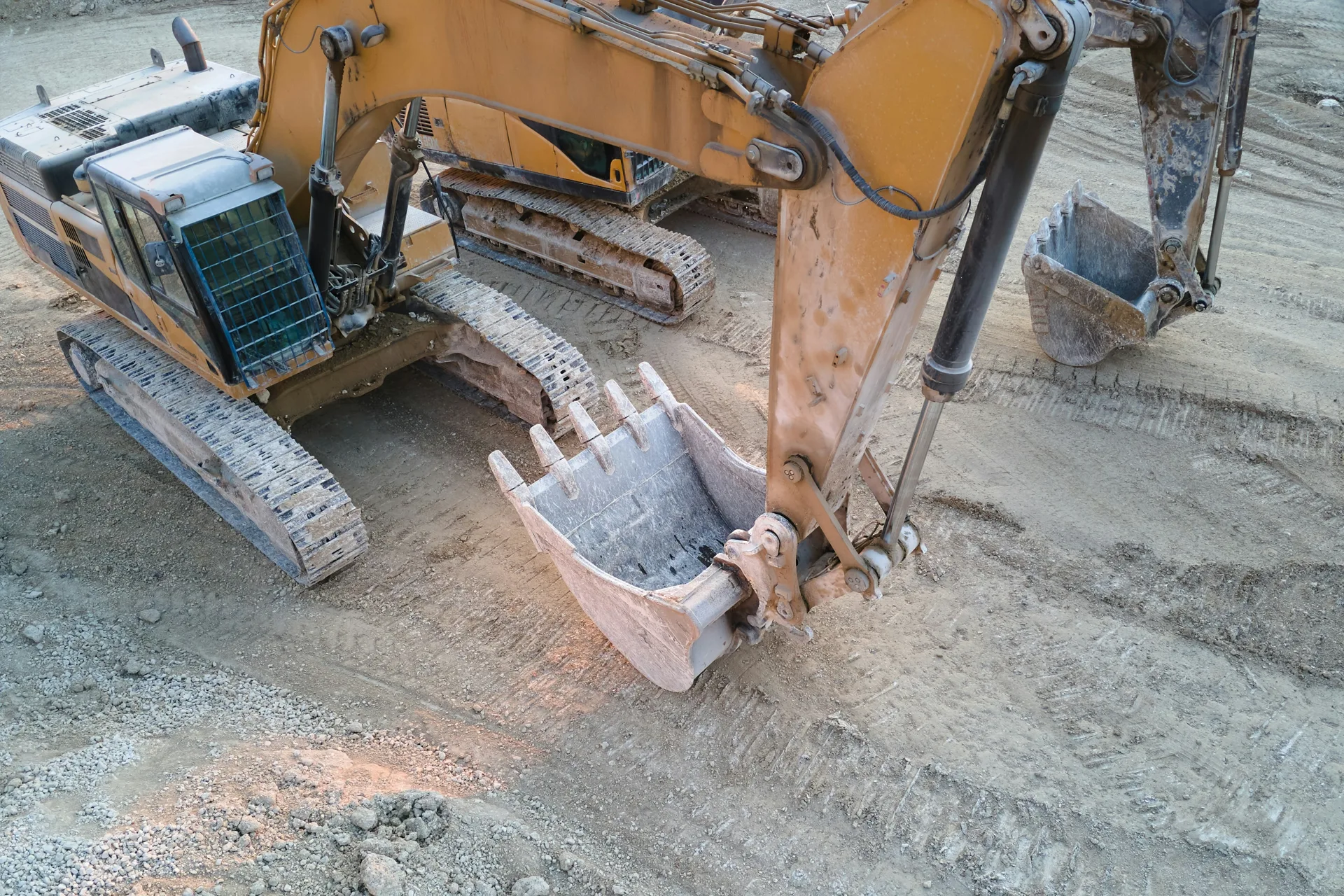 excavator working on a heavy-equipment concrete pad in Boston