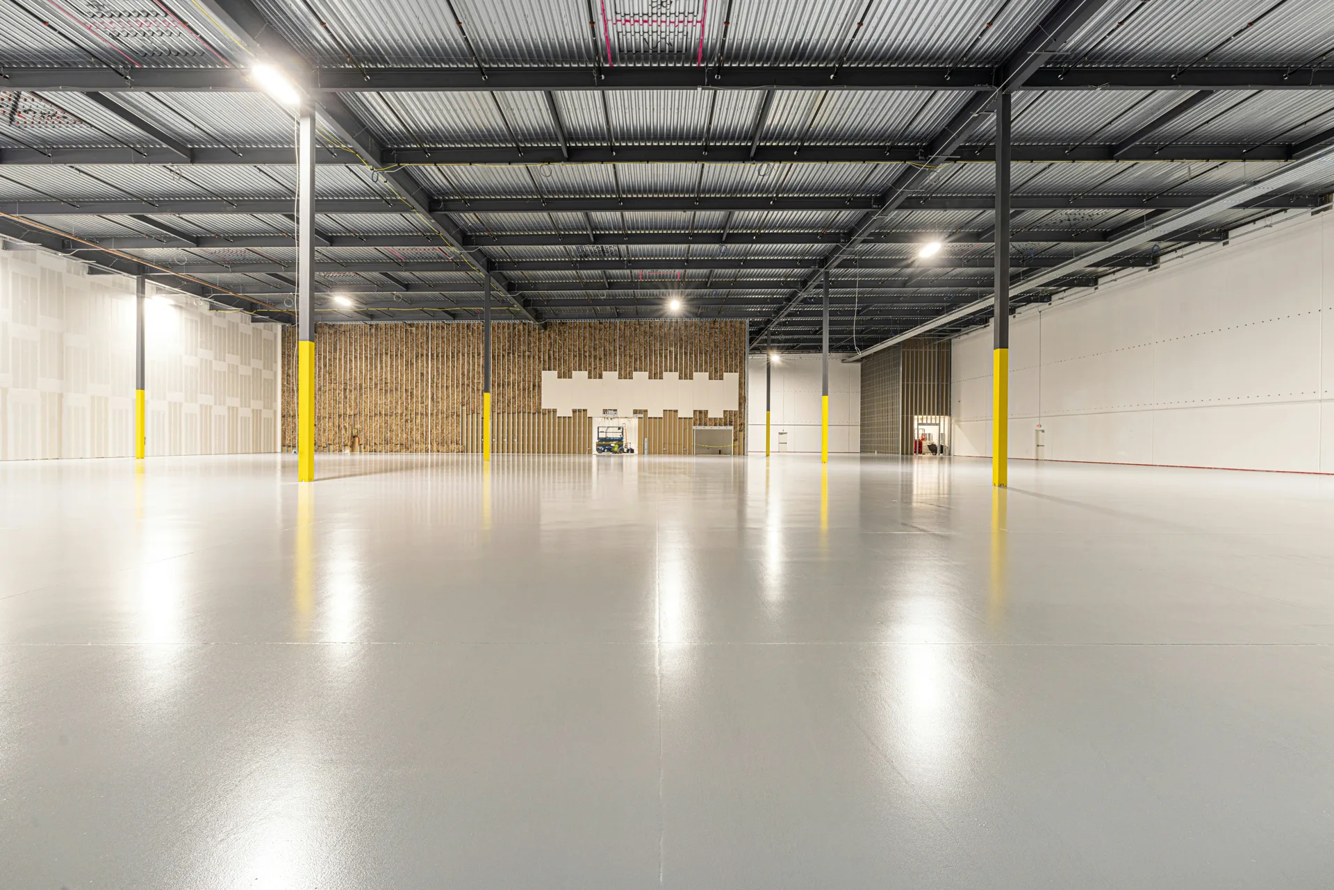 cold-storage warehouse floor with column protectors in Boston