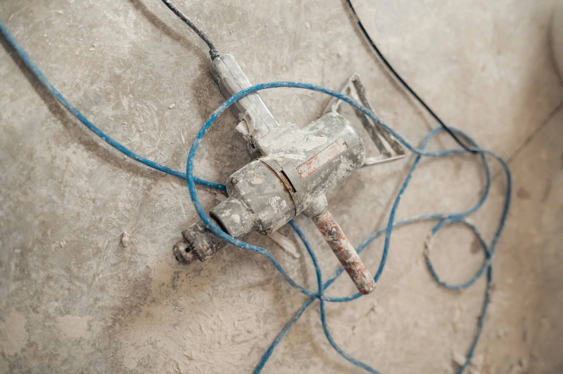jackhammer removing a failed section of concrete for repair in Boston