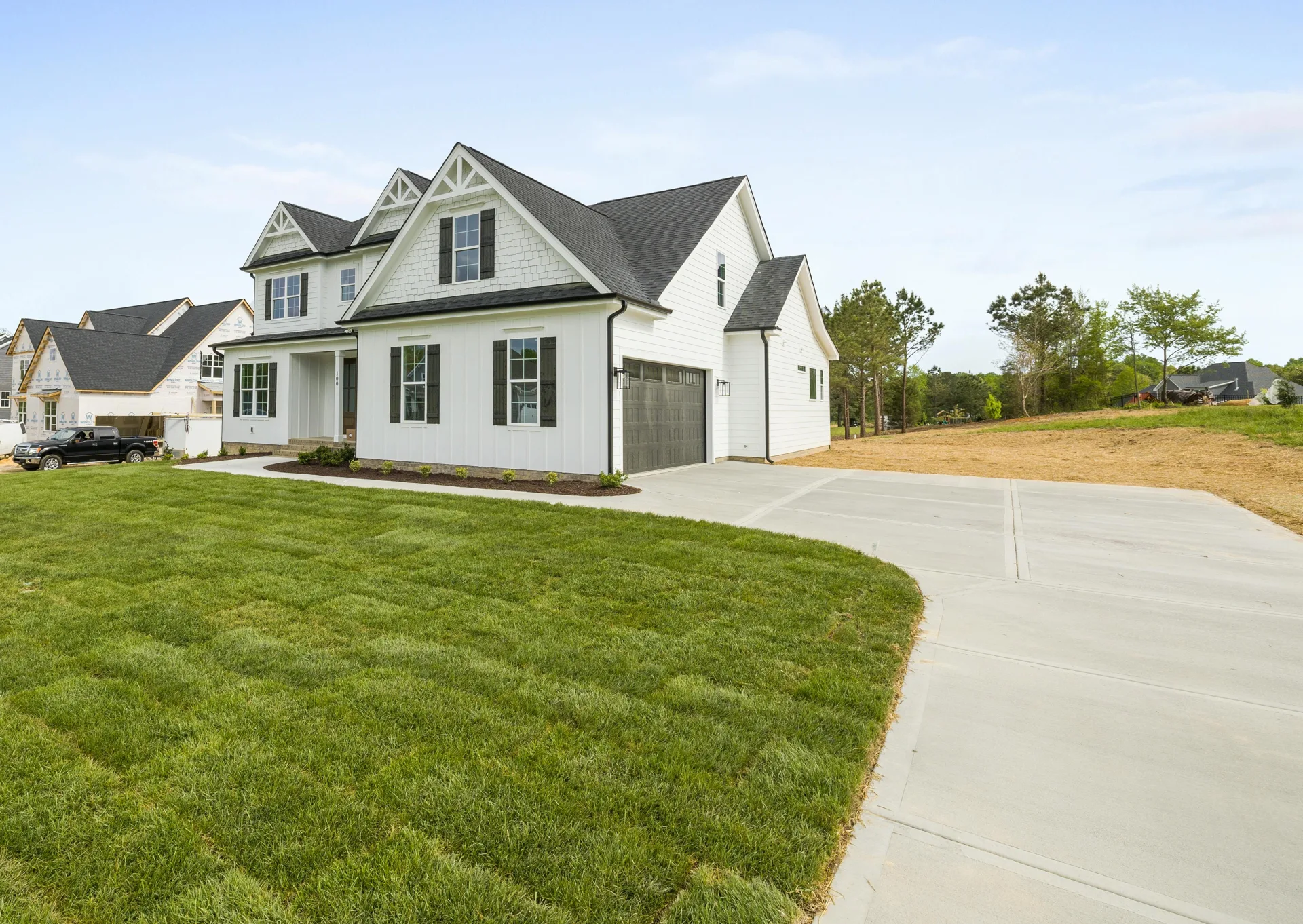 curving concrete driveway at an acreage home near Boston