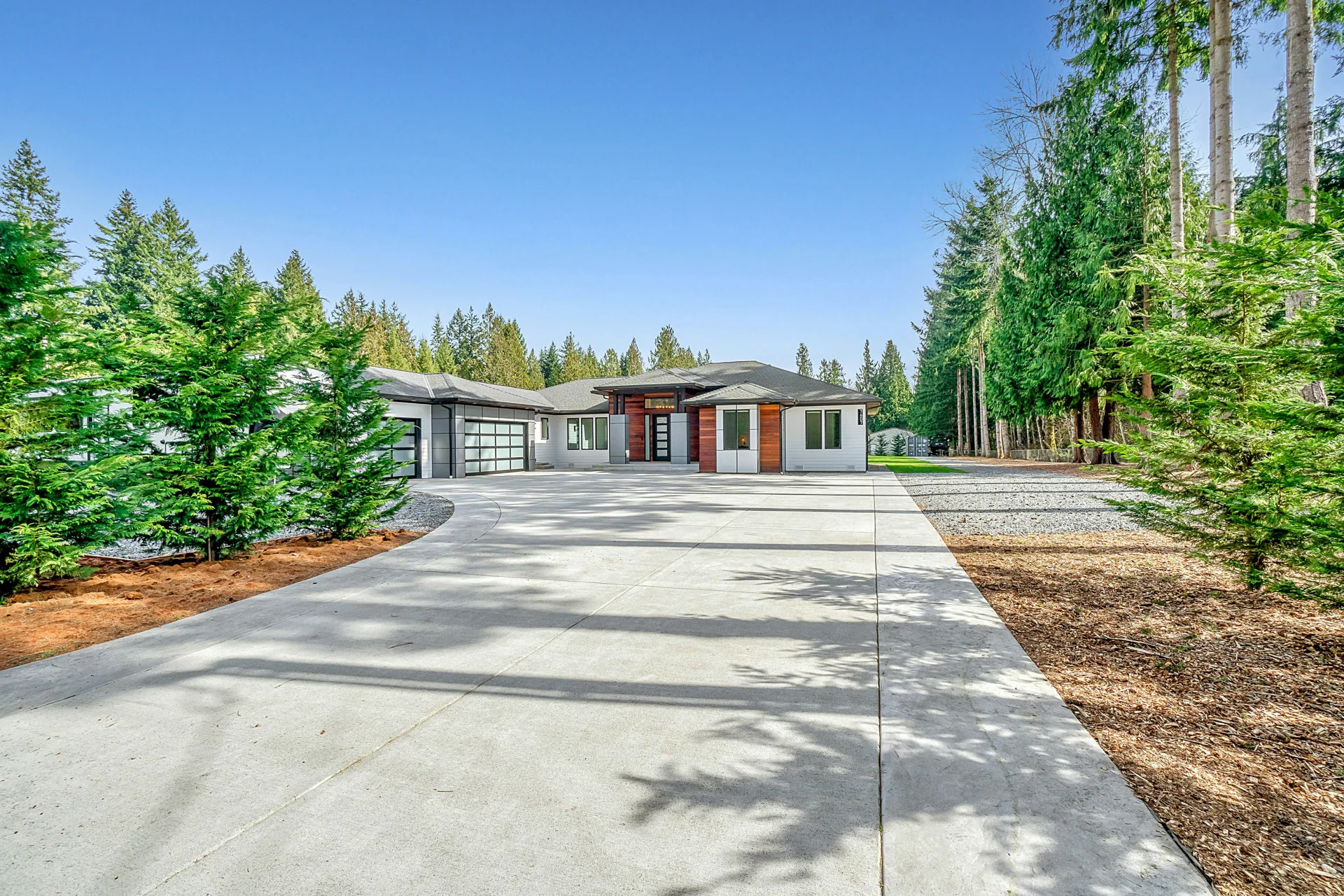 long coloured concrete driveway at a Boston home