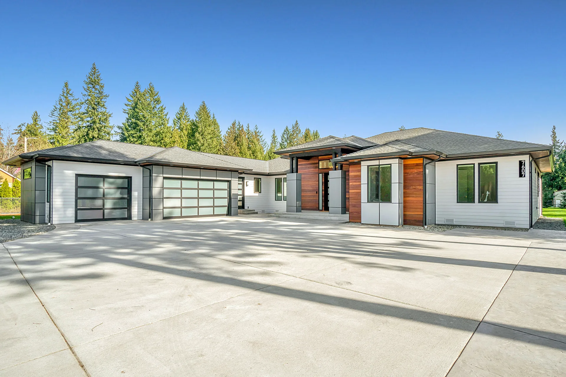 new concrete driveway at a modern three-car-garage Boston home