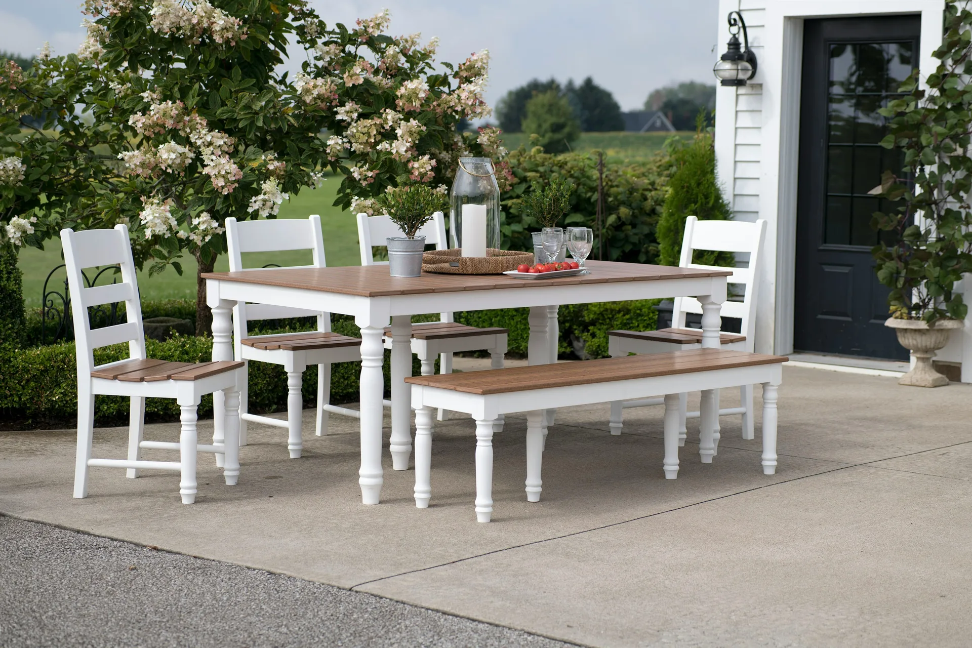 concrete patio with a dining table at a Boston farmhouse