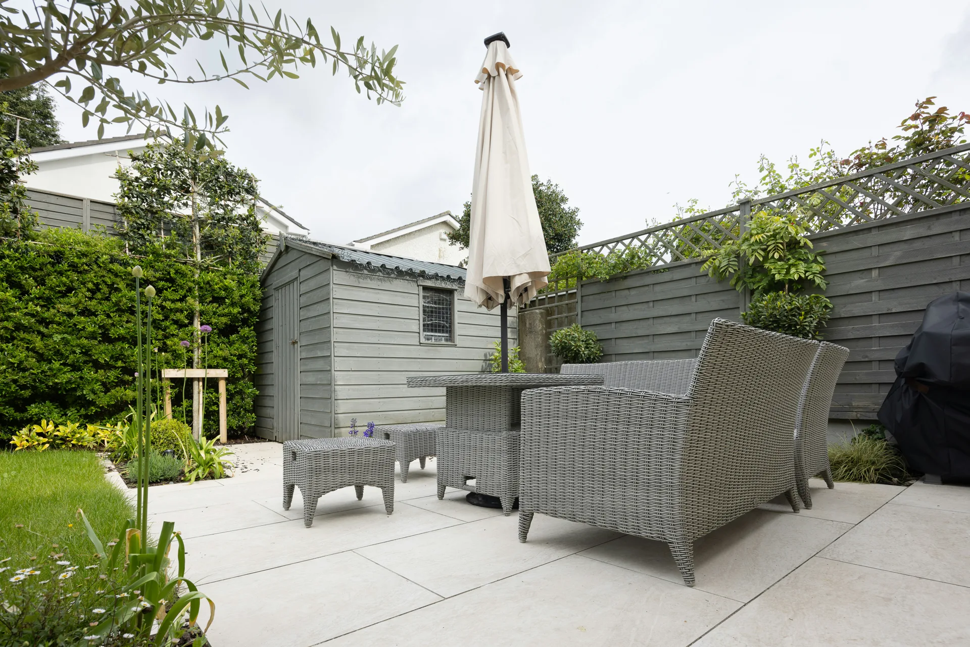 plain concrete patio in a Boston garden setting
