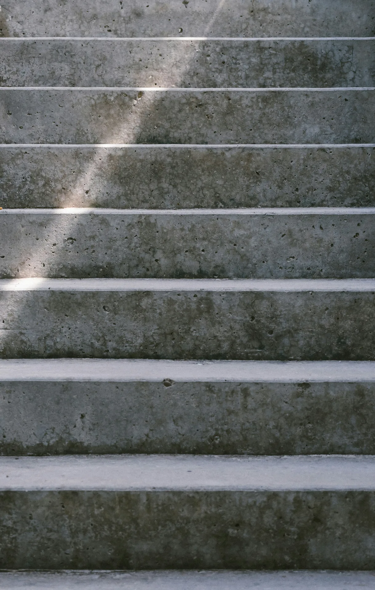 textured concrete entry steps at a Boston home