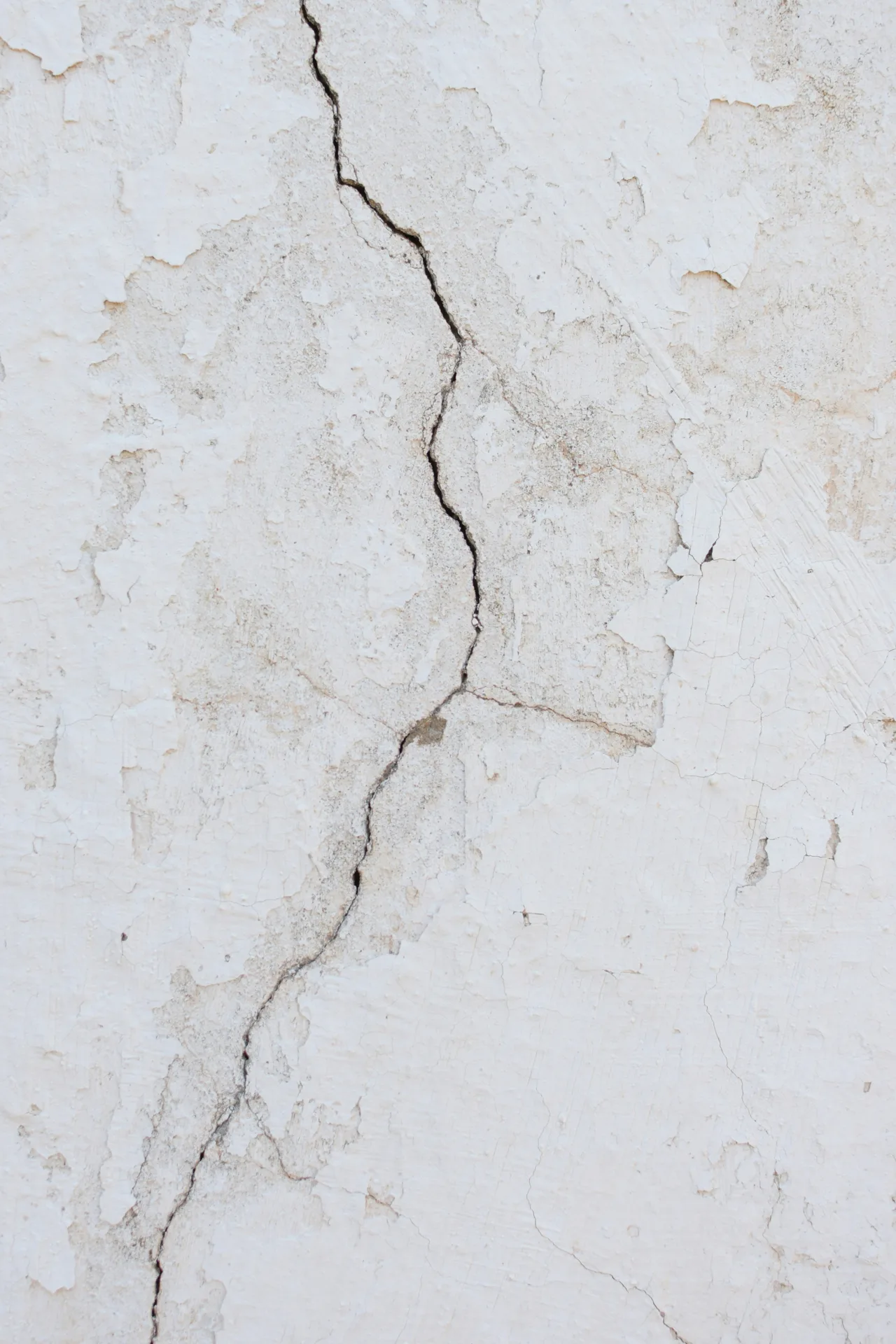 crack in a basement concrete wall before repair in Boston