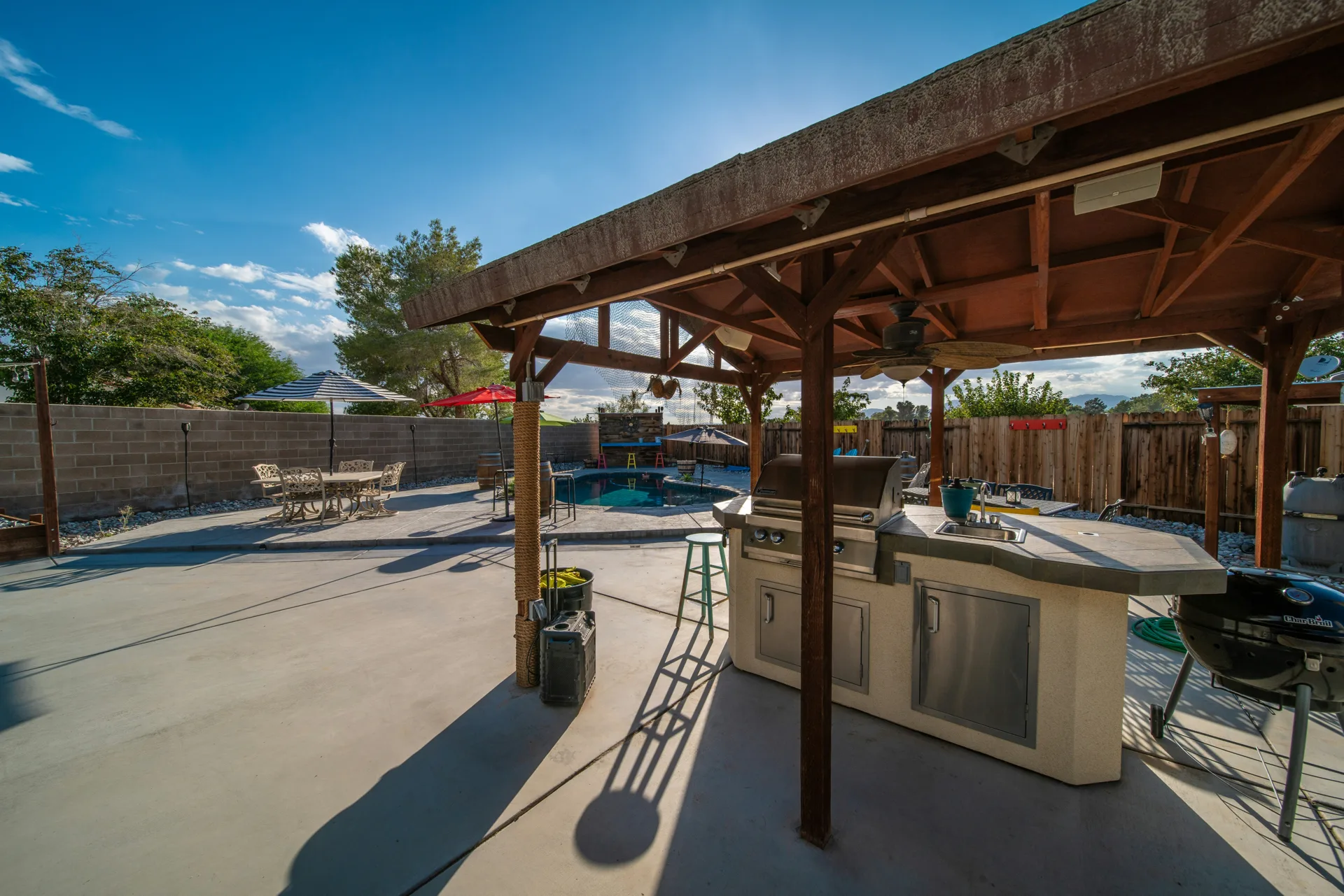 broom-finish concrete pad around a fire pit at a Boston home
