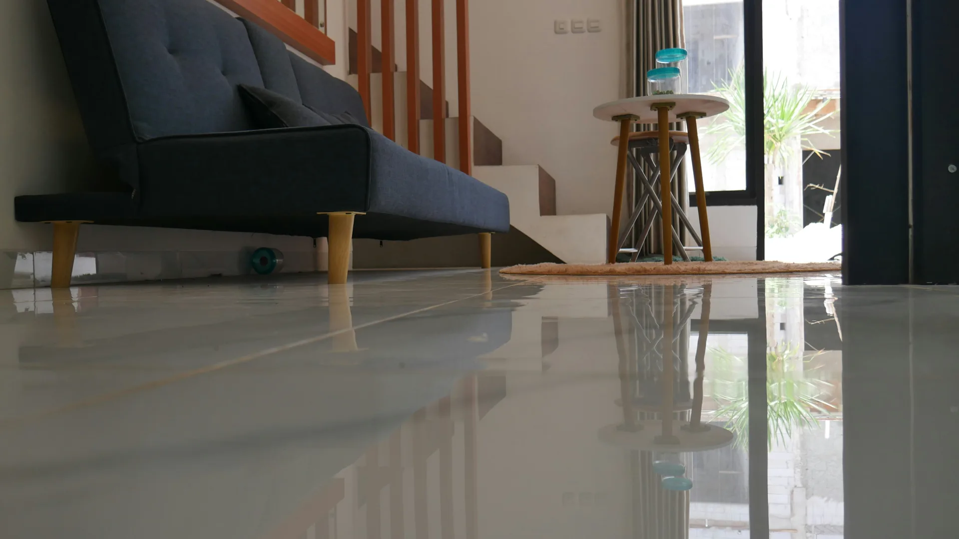 polished concrete floor reflecting light in a Boston living room